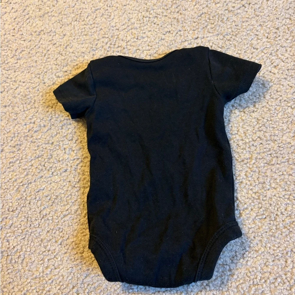 wonder nation Black Baby Bodysuit with White Text “ladies love a milk belly” - Picture 4 of 4
